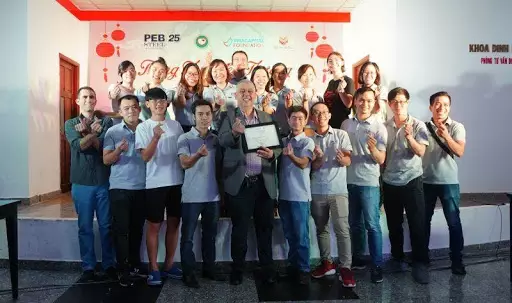 Leaders and staff of PEB Steel Buildings take a photo together.